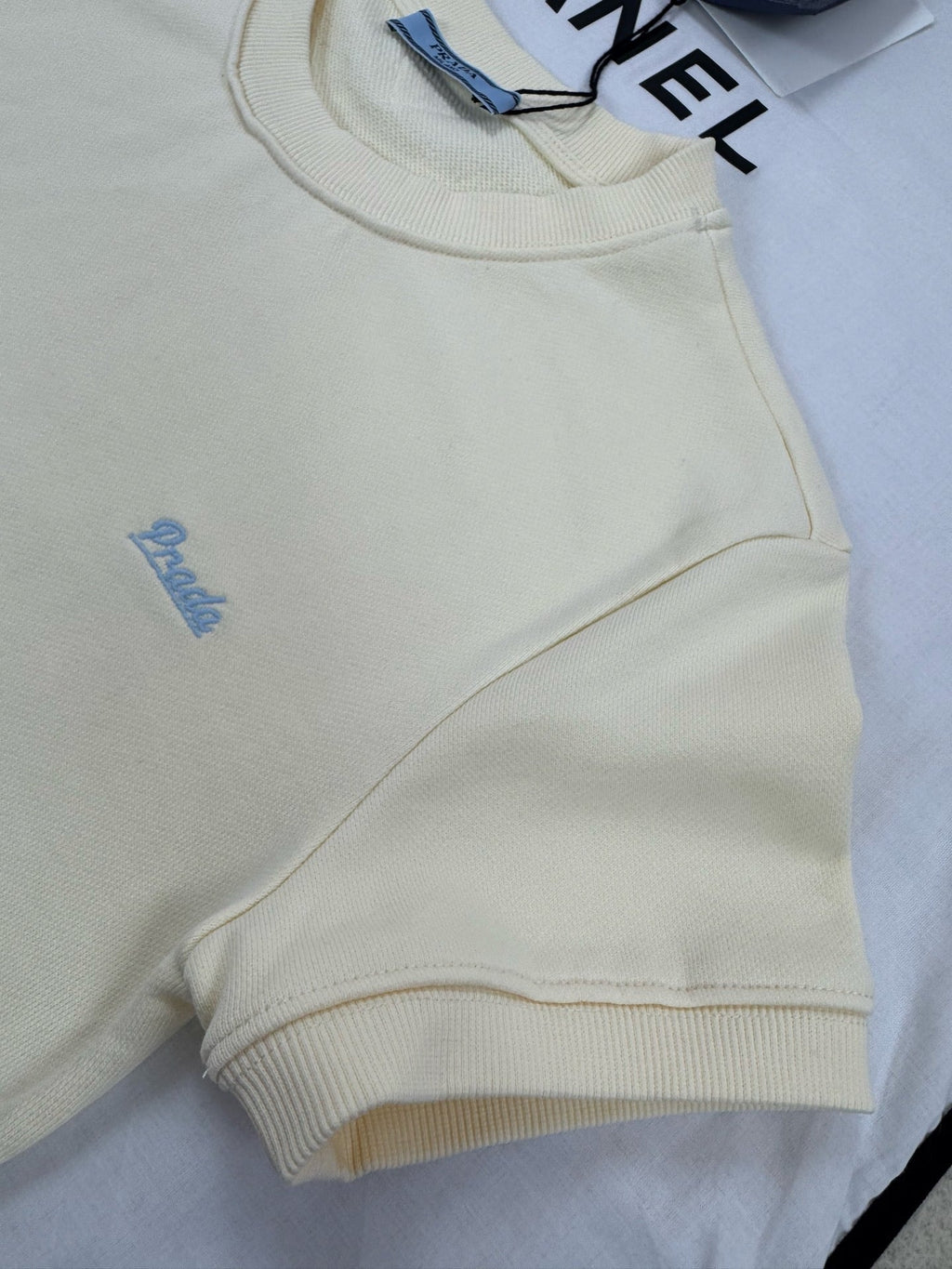 Pale yellow ribbed crew neck short-sleeved shirt